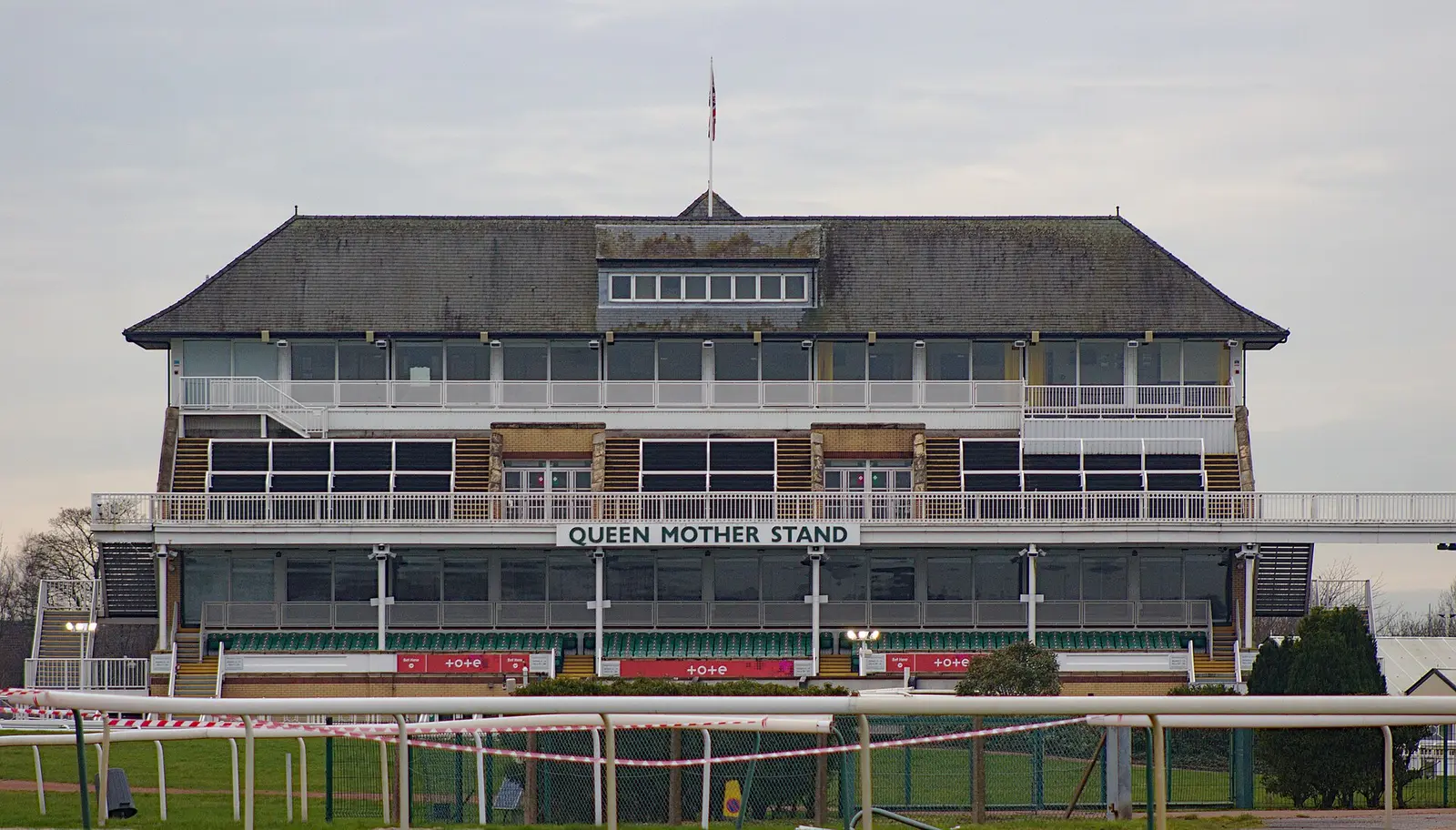 The Queen Mother Stand and the finishing straight rail at Aintree Racecourse