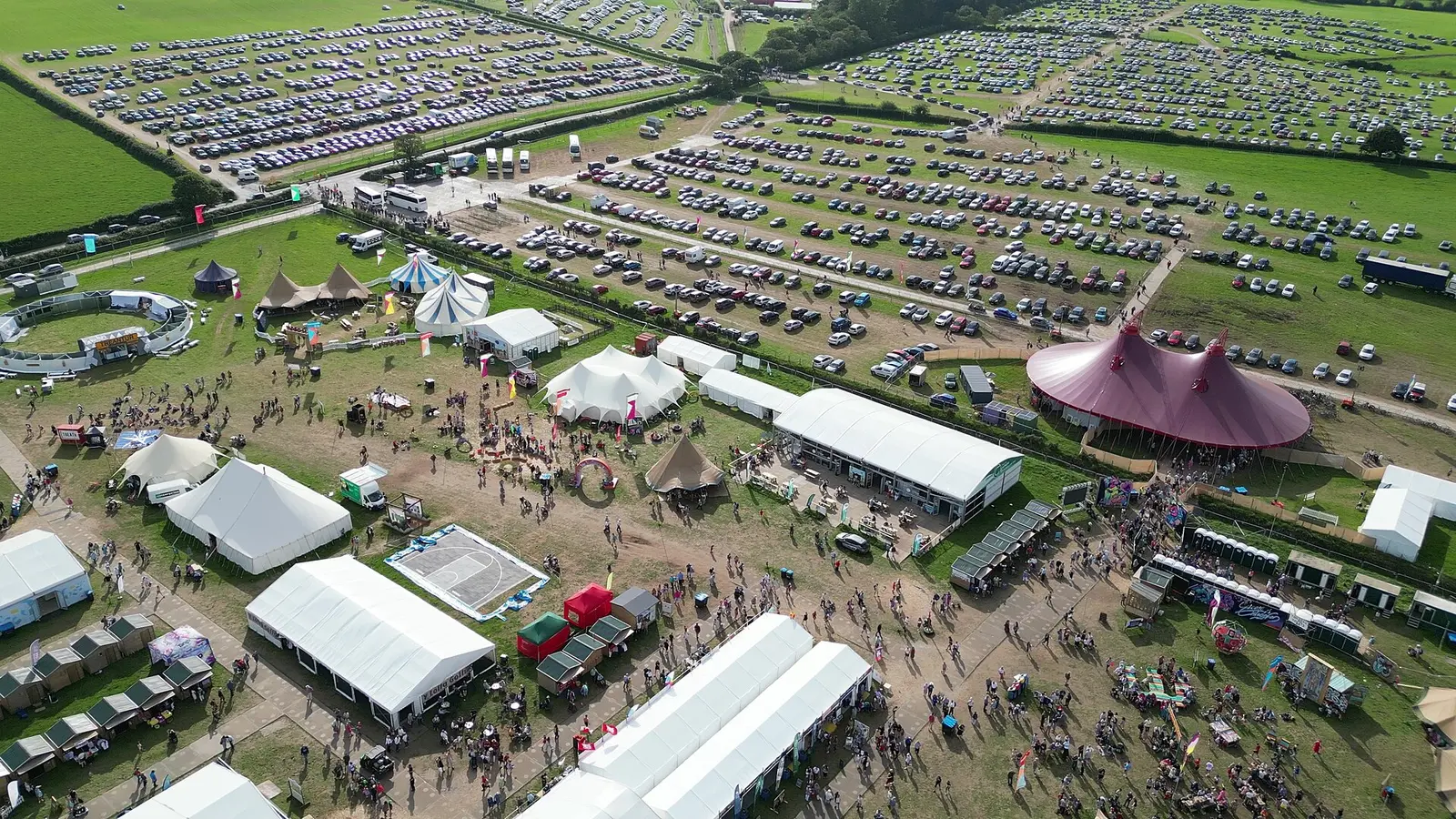 Aerial view of the National Eisteddfod field with its marquees and pink pavilion in 2023