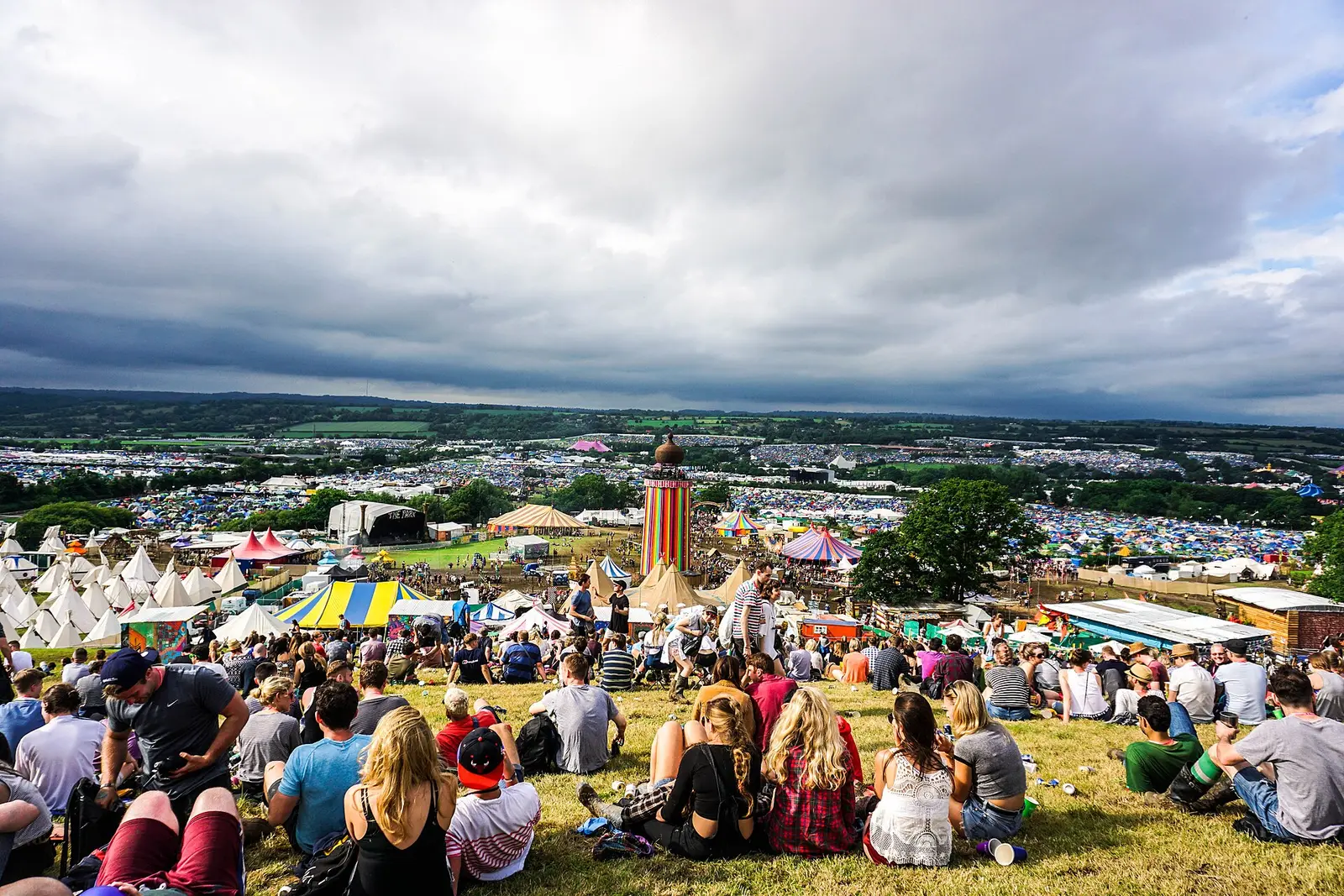 A wide view over the tents and crowds on the hillside at Worthy Farm during Glastonbury Festival
