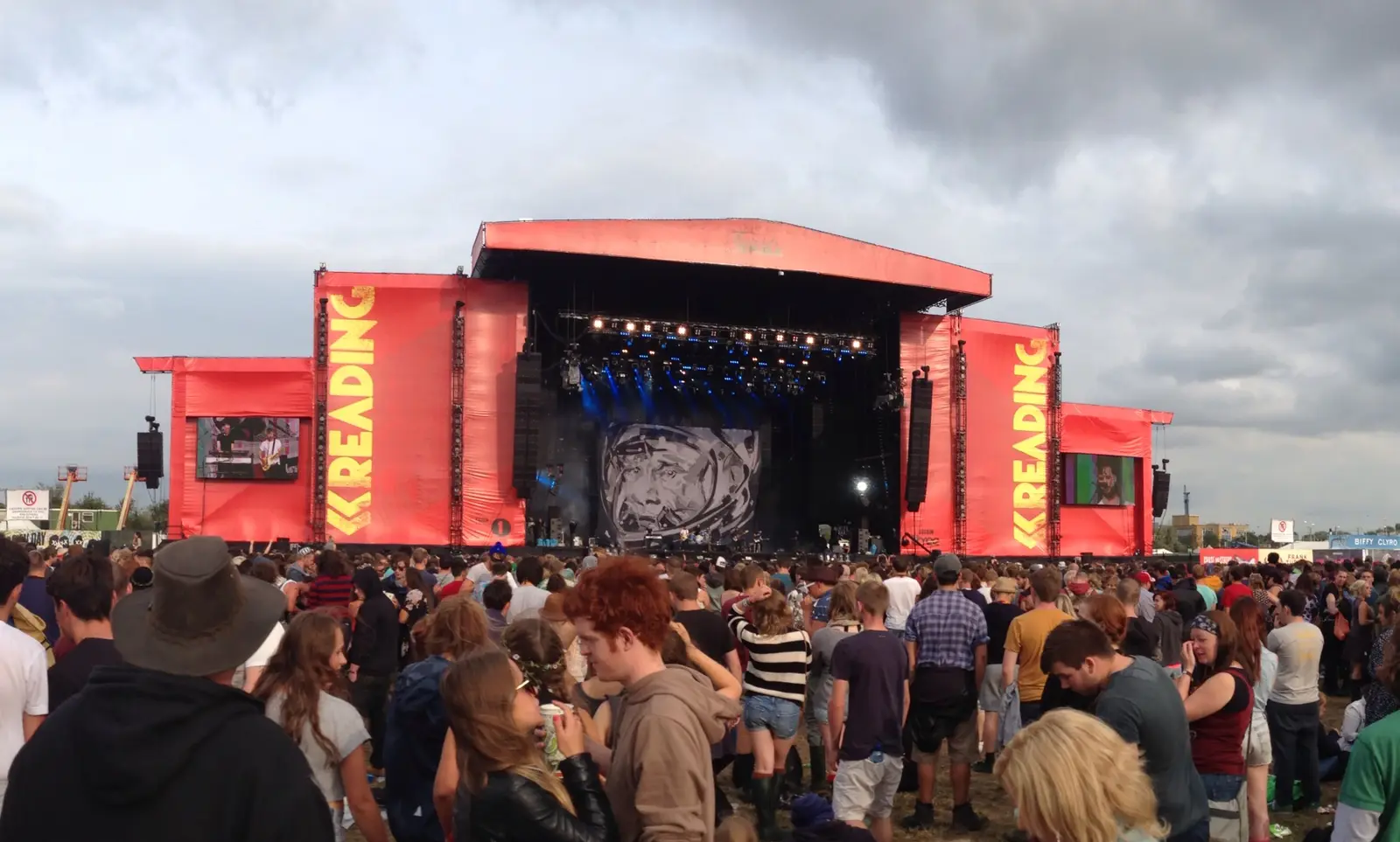 Crowds in front of the red Main Stage at Reading Festival in 2013