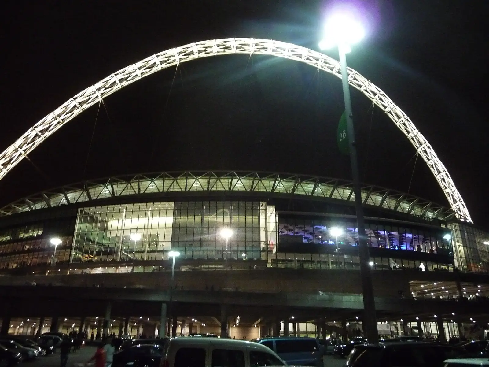 The lit Wembley arch over the stadium at night