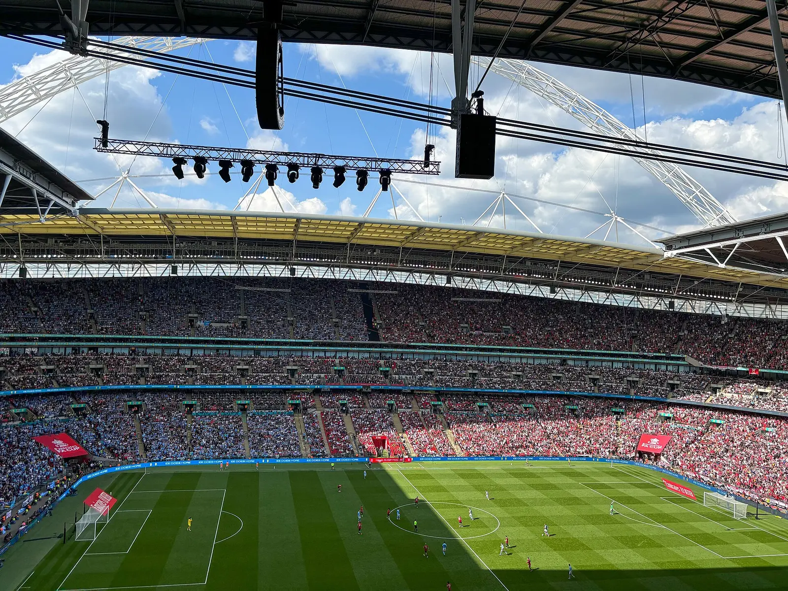 Wembley Stadium full of fans under the arch roof during an FA Cup Final